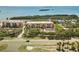 Beautiful condos near the coast with a pool surrounded by palm trees, offering a tranquil lifestyle at 1695 Pinellas Bayway S # E6, St Petersburg, FL 33715