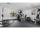 Well-equipped gym featuring modern exercise machines, fitness equipment, and a view of the lush landscaping at 1695 Pinellas Bayway S # E6, St Petersburg, FL 33715
