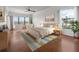 Bright bedroom featuring wood floors, a ceiling fan, and plenty of natural light at 1695 Pinellas Bayway S # E6, St Petersburg, FL 33715
