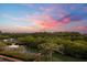 Beautiful waterway and marina views at sunset with surrounding trees and boats at 1695 Pinellas Bayway S # E6, St Petersburg, FL 33715