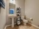 Clean and simple powder room with pedestal sink, and toilet at 18345 Fish Loop, Land O Lakes, FL 34638