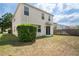 Large grassy backyard with partial fence, showing exterior of home at 18837 Litzau Ln, Land O Lakes, FL 34638