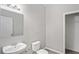 Powder room features a pedestal sink and modern fixtures at 18837 Litzau Ln, Land O Lakes, FL 34638