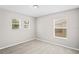 Bedroom with neutral walls, carpet, and bright windows at 18837 Litzau Ln, Land O Lakes, FL 34638