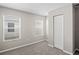 Bedroom with two windows and a closet at 18837 Litzau Ln, Land O Lakes, FL 34638