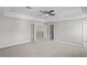 Bright main bedroom features neutral walls, carpet, and ample closet space at 18837 Litzau Ln, Land O Lakes, FL 34638