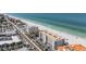 Aerial view of multi-story condo building located on oceanfront with parking and views of beach at 19418 Gulf Blvd # 507, Indian Shores, FL 33785