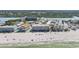 An aerial view of a condo building along a coastline showing the beach, pool and waterway at 19418 Gulf Blvd # 507, Indian Shores, FL 33785