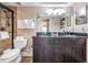 Full bathroom with a dual sink vanity, a large mirror, and a step in shower at 19418 Gulf Blvd # 507, Indian Shores, FL 33785