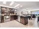Open concept kitchen features stainless steel appliances and overlooks the dining and living areas at 19418 Gulf Blvd # 507, Indian Shores, FL 33785