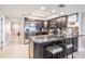 Updated kitchen with granite counters, island seating, and stainless steel appliances at 19418 Gulf Blvd # 507, Indian Shores, FL 33785