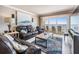 Well-appointed living room with comfortable seating and sliding doors leading to a private balcony with ocean views at 19418 Gulf Blvd # 507, Indian Shores, FL 33785