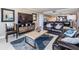 Well-appointed living room with comfortable seating and sliding doors leading to a private balcony with ocean views at 19418 Gulf Blvd # 507, Indian Shores, FL 33785