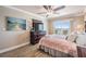 Beautiful main bedroom with a ceiling fan and sliding doors leading to a private balcony with ocean views at 19418 Gulf Blvd # 507, Indian Shores, FL 33785