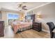 Beautiful main bedroom with a ceiling fan and sliding doors leading to a private balcony with ocean views at 19418 Gulf Blvd # 507, Indian Shores, FL 33785
