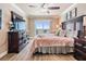 Beautiful main bedroom with a ceiling fan and sliding doors leading to a private balcony with ocean views at 19418 Gulf Blvd # 507, Indian Shores, FL 33785