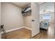 Walk-in closet and view into a bedroom with a ceiling fan and window at 19418 Gulf Blvd # 507, Indian Shores, FL 33785