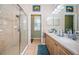Bathroom featuring a walk-in shower, double sink vanity, and tiled floors at 19610 Sunset Bay Dr, Land O Lakes, FL 34638