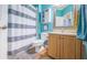 Bright bathroom featuring a shower with tub, and a wood vanity with counter at 19610 Sunset Bay Dr, Land O Lakes, FL 34638