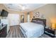 Spacious bedroom boasts hardwood floors, ensuite access and large closets at 19610 Sunset Bay Dr, Land O Lakes, FL 34638