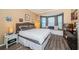 Spacious bedroom boasts a bay window with cushioned seating and hardwood floors at 19610 Sunset Bay Dr, Land O Lakes, FL 34638