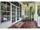 Relax on the porch of the Lake Shore Ranch clubhouse, featuring a welcoming entrance and comfortable seating at 19610 Sunset Bay Dr, Land O Lakes, FL 34638