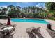 Large community pool offers plenty of room for swimming laps and relaxation, surrounded by lush landscaping at 19610 Sunset Bay Dr, Land O Lakes, FL 34638