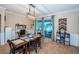 Bright dining area with backyard access includes modern light fixture and built-in shelving at 19610 Sunset Bay Dr, Land O Lakes, FL 34638