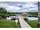 Community fishing dock and seating area on a tranquil lake at 19610 Sunset Bay Dr, Land O Lakes, FL 34638