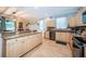 Bright eat-in kitchen features stainless appliances, tile flooring and granite counters at 19610 Sunset Bay Dr, Land O Lakes, FL 34638