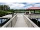 Community lake pier with pavilion, offering scenic views and a relaxing waterfront amenity at 19610 Sunset Bay Dr, Land O Lakes, FL 34638
