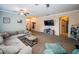 Inviting living room with a comfortable seating arrangement, large TV, and cozy ambiance at 19610 Sunset Bay Dr, Land O Lakes, FL 34638