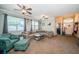 Spacious living room with plush seating, neutral tones, and abundant natural light at 19610 Sunset Bay Dr, Land O Lakes, FL 34638