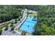 Aerial view of a neighborhood's recreational area featuring tennis courts, basketball courts, pool, playground, and parking at 2817 Cordoba Ranch Blvd, Lutz, FL 33559