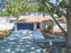 Charming single-story home featuring a two-car garage and well-maintained landscaping at 3039 Sean Way, Palm Harbor, FL 34684