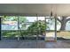Enclosed patio with tile flooring and a view of the backyard, great for outdoor relaxation at 3039 Sean Way, Palm Harbor, FL 34684