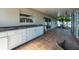 View of the back patio with an outdoor sink/kitchen setup and access to the backyard at 3039 Sean Way, Palm Harbor, FL 34684