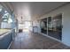 Enclosed patio with sliding door access to the interior, sink, and plenty of space at 3039 Sean Way, Palm Harbor, FL 34684