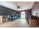 Spacious room with a ceiling fan and a large window, offering lots of natural light, and plenty of space at 3039 Sean Way, Palm Harbor, FL 34684