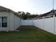 Spacious backyard with a well-kept lawn and privacy fencing offering a secure and enjoyable outdoor space at 30434 Colehaven Ct, Wesley Chapel, FL 33543