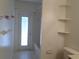 Bathroom featuring a tub, toilet and shelving at 30434 Colehaven Ct, Wesley Chapel, FL 33543