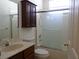 Bathroom features a vanity, toilet, frosted shower doors and medicine cabinet at 30434 Colehaven Ct, Wesley Chapel, FL 33543