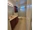 Functional bathroom with updated vanity, tub, and shower combination provides a refreshing space at 30434 Colehaven Ct, Wesley Chapel, FL 33543