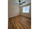 Cozy bedroom with modern ceiling fan and light hardwood floors, creating a comfortable space at 30434 Colehaven Ct, Wesley Chapel, FL 33543