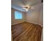 Bedroom with light hardwood floors and natural light is both warm and welcoming at 30434 Colehaven Ct, Wesley Chapel, FL 33543