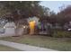 Charming single-Gathering home with a well-maintained lawn and mature trees at dusk at 30434 Colehaven Ct, Wesley Chapel, FL 33543