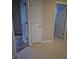 Inviting hallway featuring classic tile flooring connecting different parts of the home at 30434 Colehaven Ct, Wesley Chapel, FL 33543