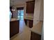 Kitchen area featuring tile flooring, a built-in desk, and backyard views at 30434 Colehaven Ct, Wesley Chapel, FL 33543