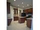Spacious kitchen with wooden cabinets, tile floors, and modern appliances at 30434 Colehaven Ct, Wesley Chapel, FL 33543