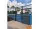 Fenced community tennis court with posted rules and regulations for residents and guests at 30434 Colehaven Ct, Wesley Chapel, FL 33543